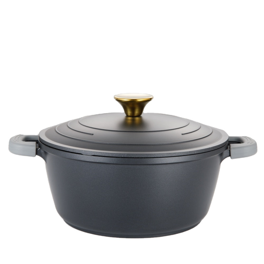 Black pot with gold lid knob on a white background