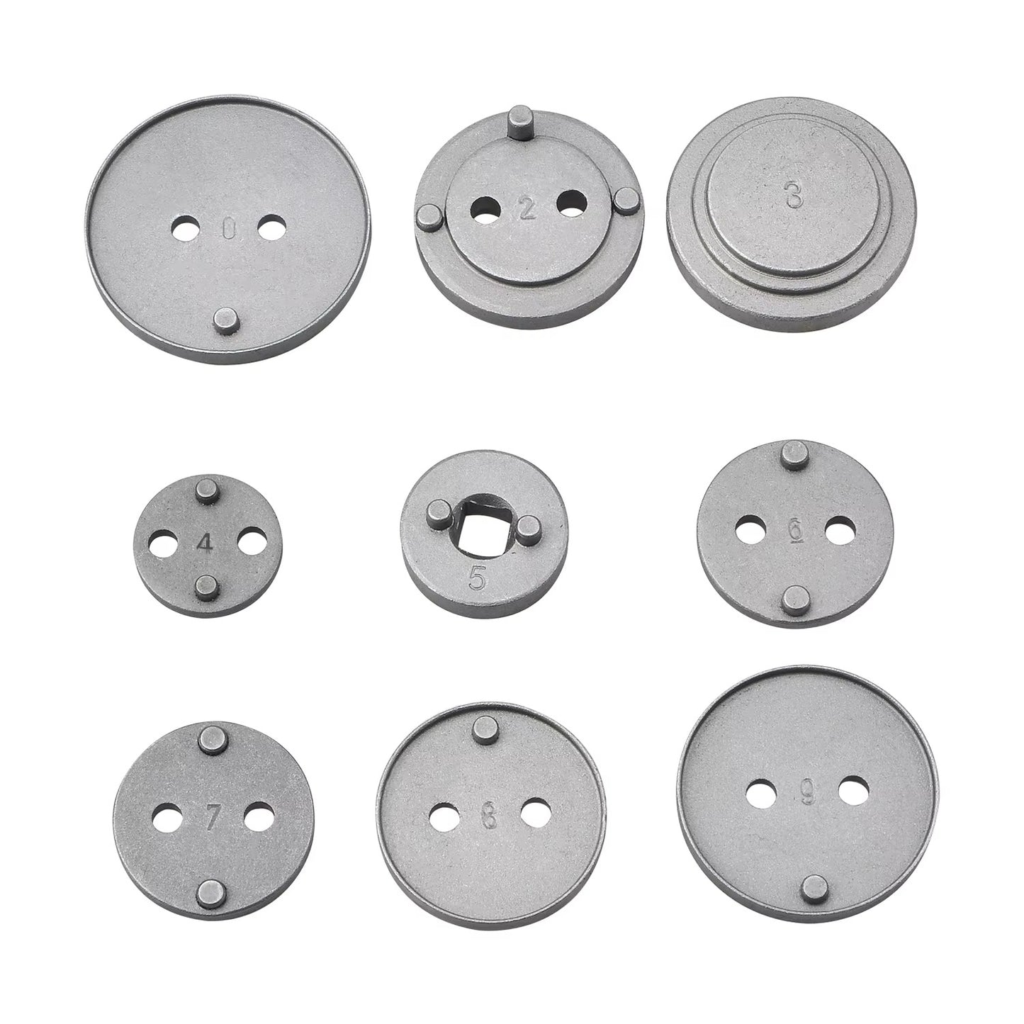 Set of metallic circular components with different numbers on a white background