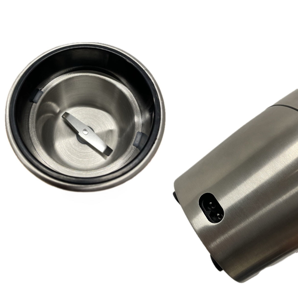 Stainless steel coffee grinder with top cover on a white background