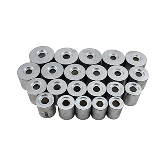 Multiple metal bushings stacked on a white background