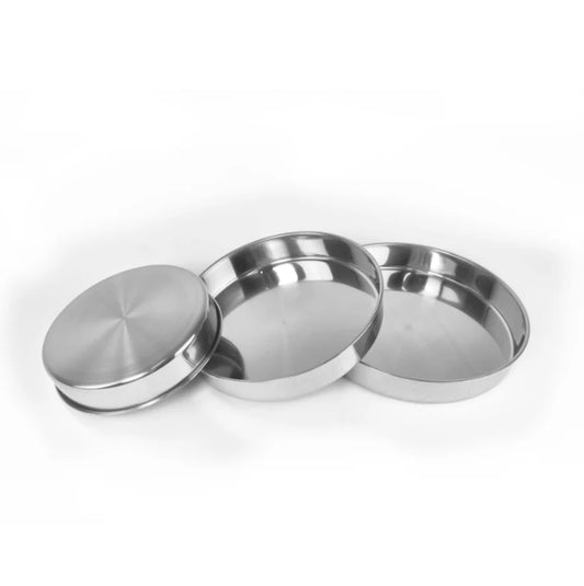 Three stainless steel bowls on a white background