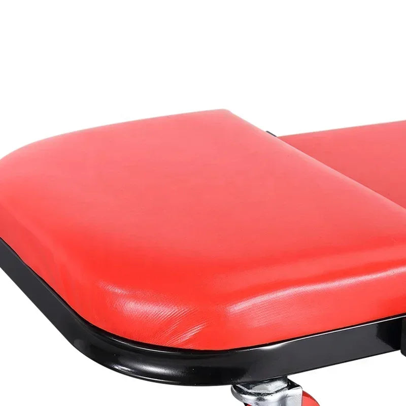 Red motorcycle seat with black border on a white background