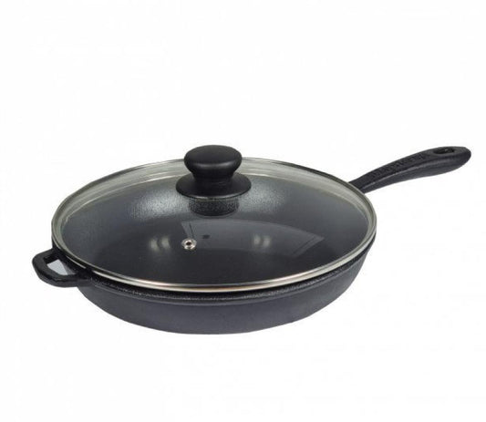Black cast iron frying pan with glass lid on a white background