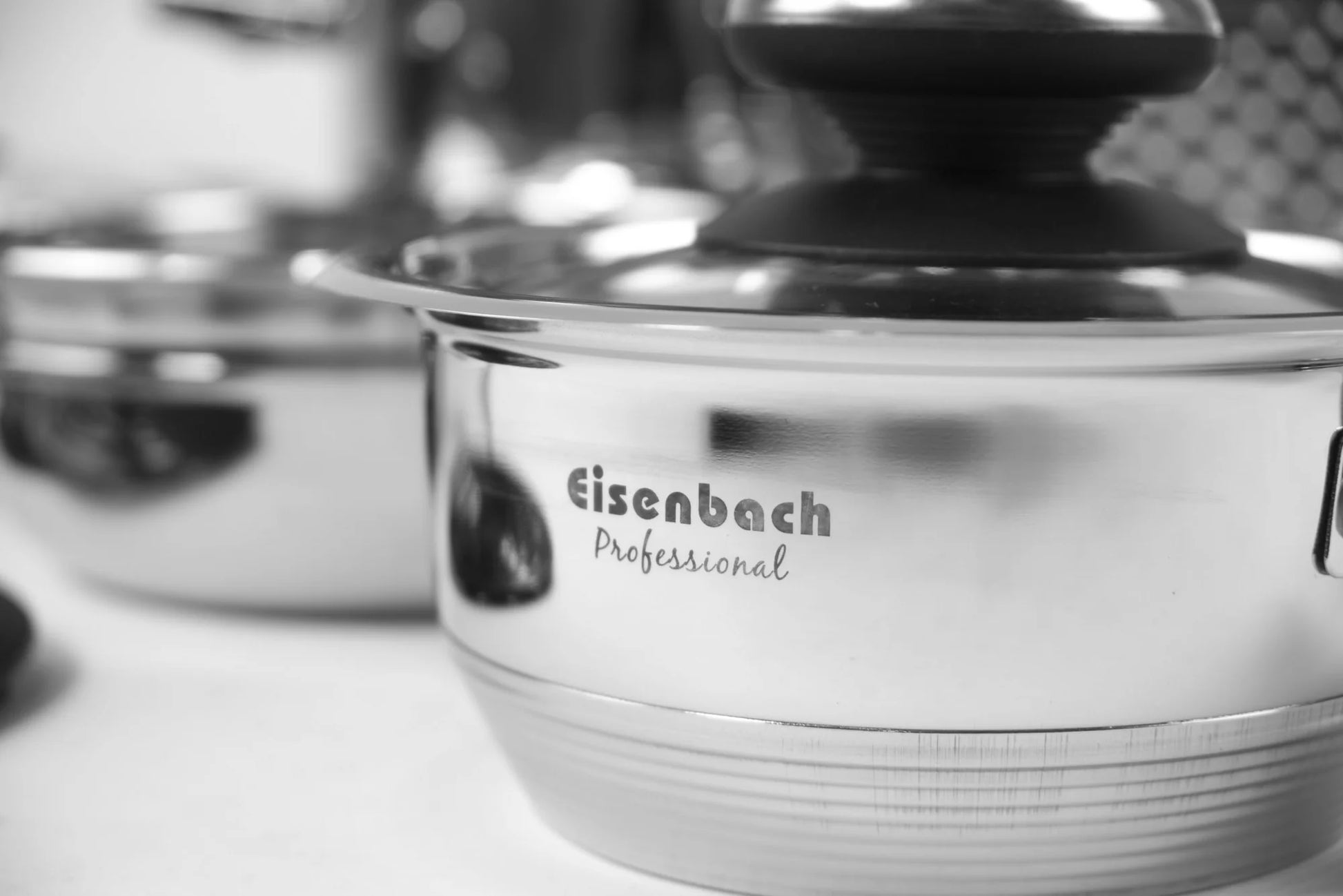 Stainless steel bowl with 'Eisenbach Professional' branding on a blurred background