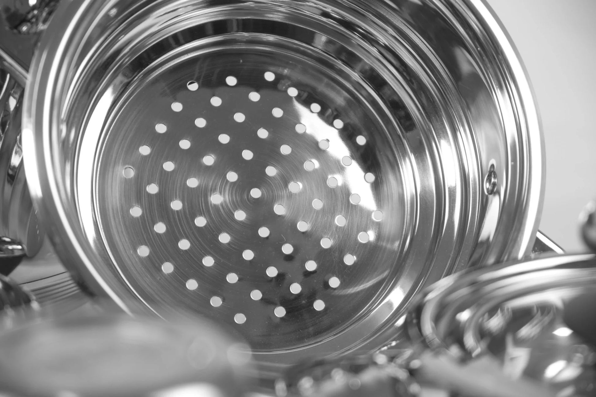 Close-up of a metallic strainer with holes