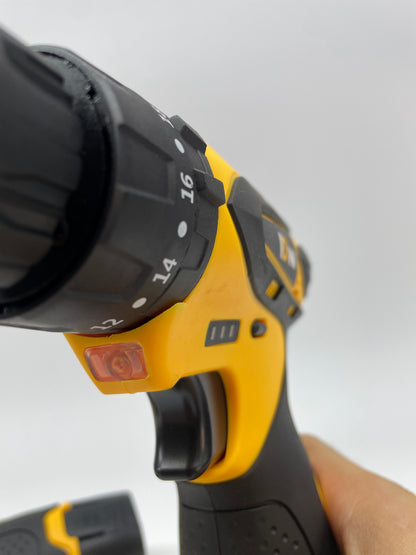 Close-up of a power drill with a focus on the chuck and trigger mechanism.