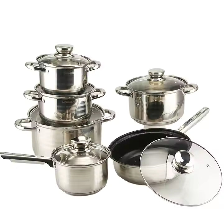 Set of stainless steel cookware with lids on a white background