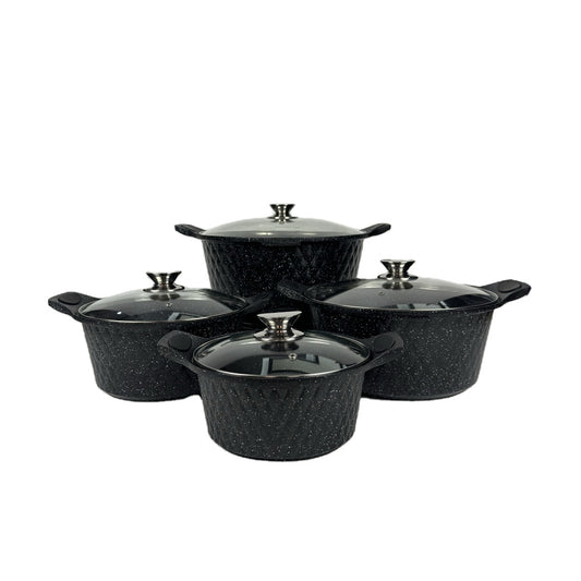 Set of four black speckled cookware pots with lids on a white background