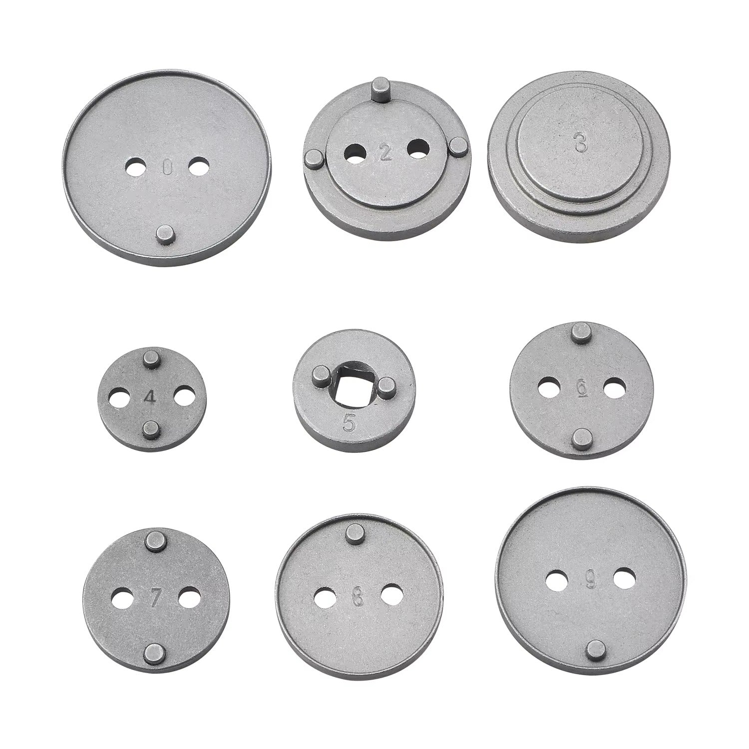 Set of metallic circular components with different numbers on a white background