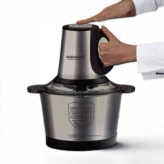 Stainless steel food processor with a hand pressing the top, on a white background
