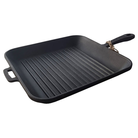 Black cast iron grill pan with handles on a white background