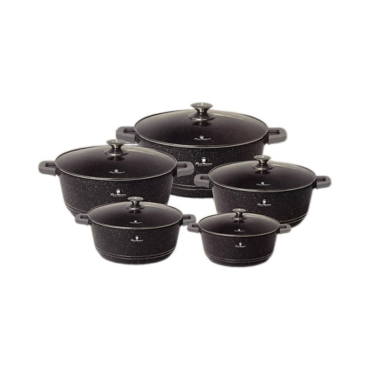 Set of black cookware with speckled pattern on a white background