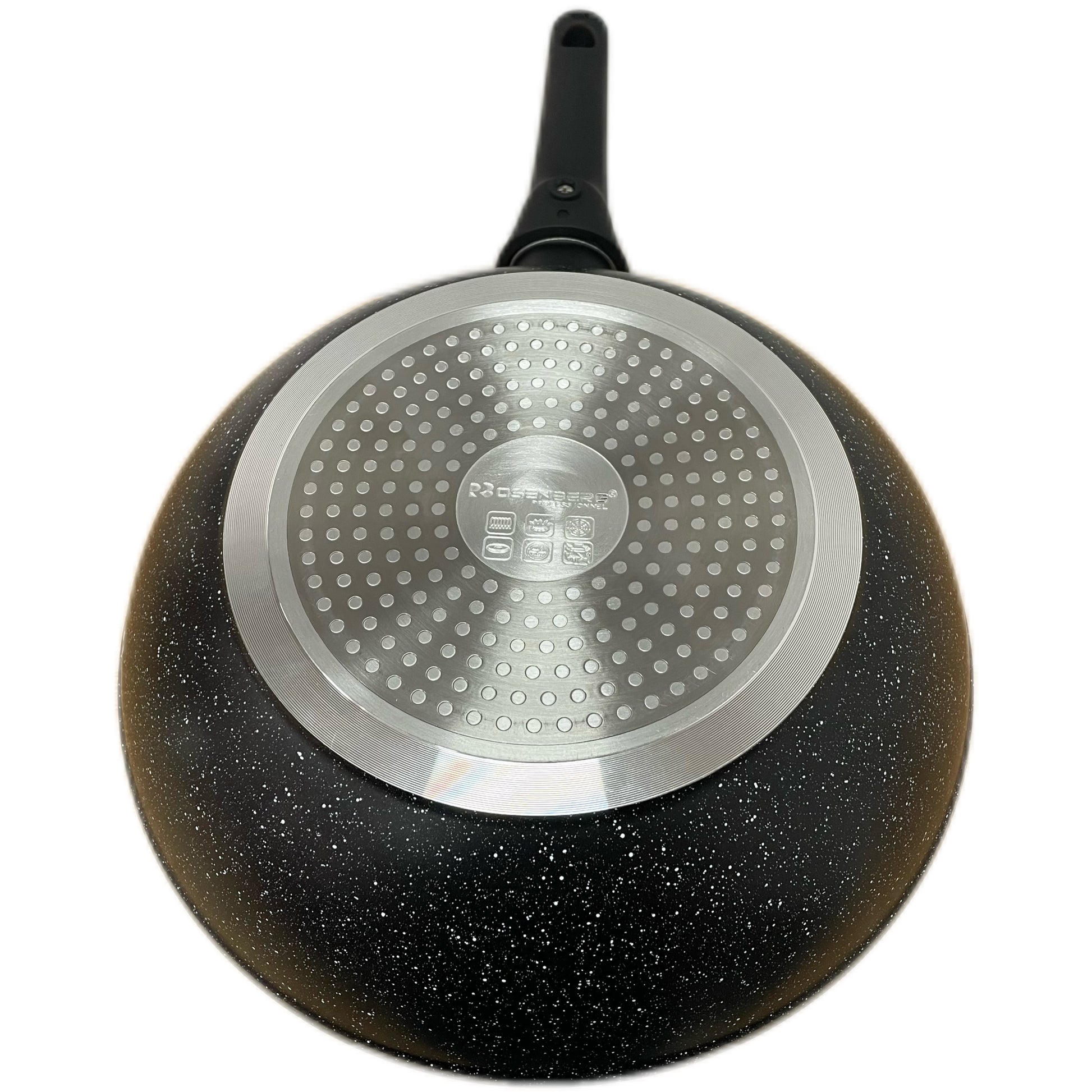 Black speckled frying pan with a silver base on a white background