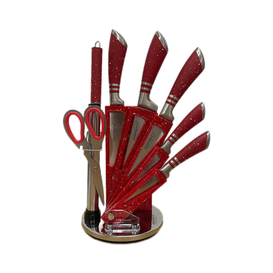 Red glittery kitchen utensil set shaped like a hand on a white background