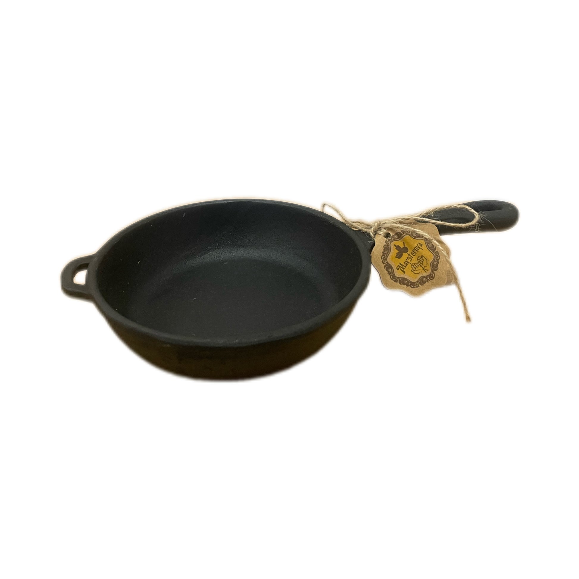 Small black cast iron skillet with a handle on a white background