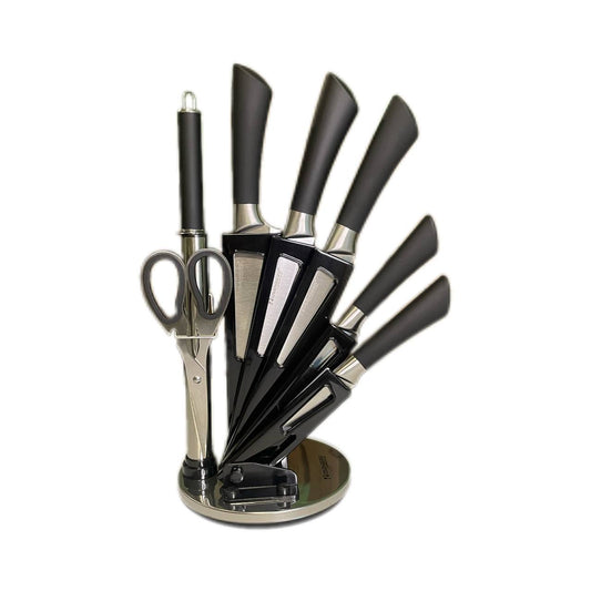 Set of black kitchen knives and scissors on a white background