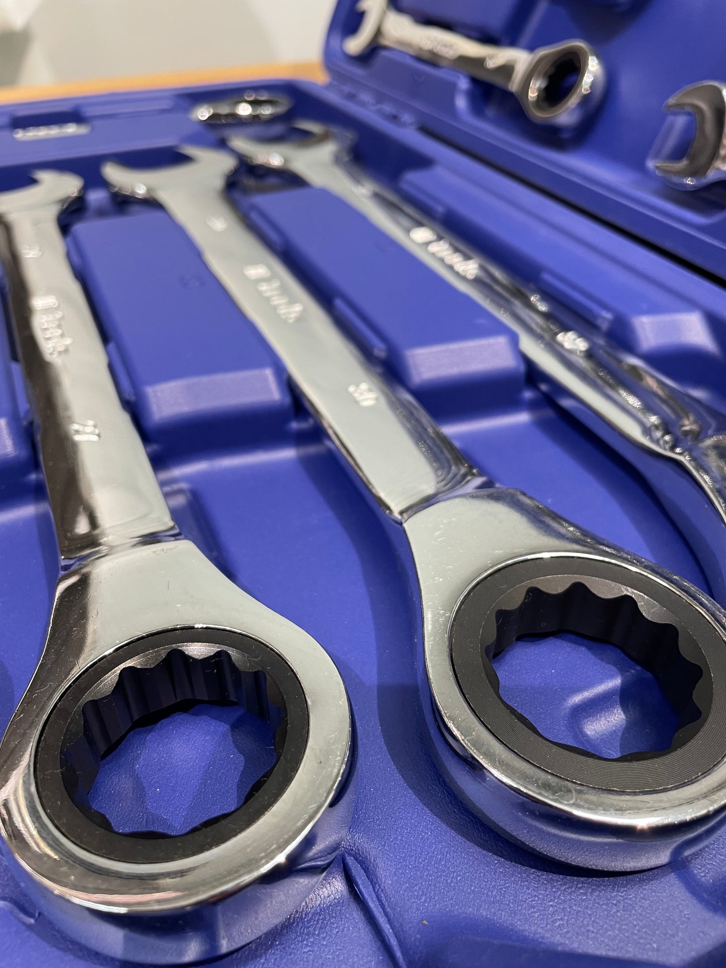 Set of wrenches in a blue tool box
