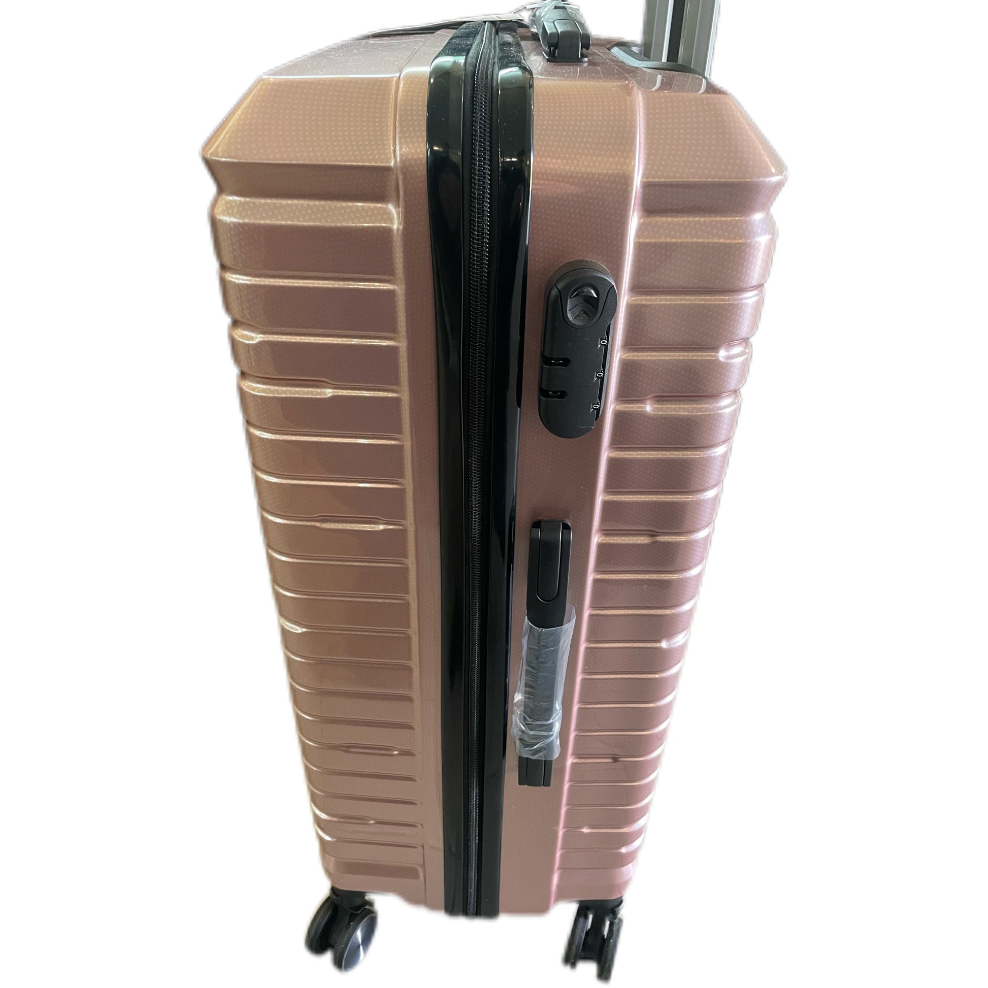 Rose gold suitcase with black handle and wheels on a white background