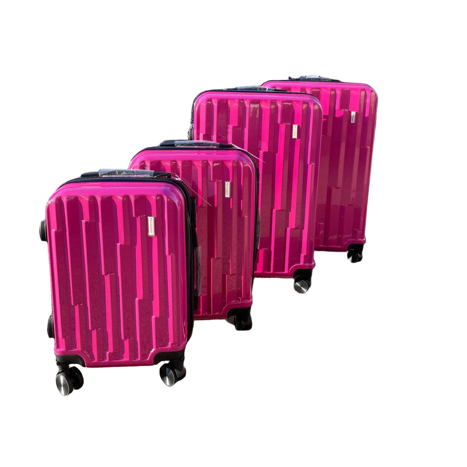 Four pink suitcases on wheels arranged in a row outdoors with a building and trees in the background.