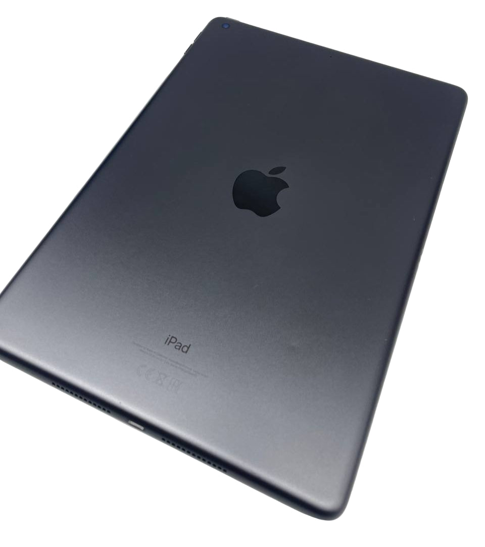 Black iPad on a light gray surface