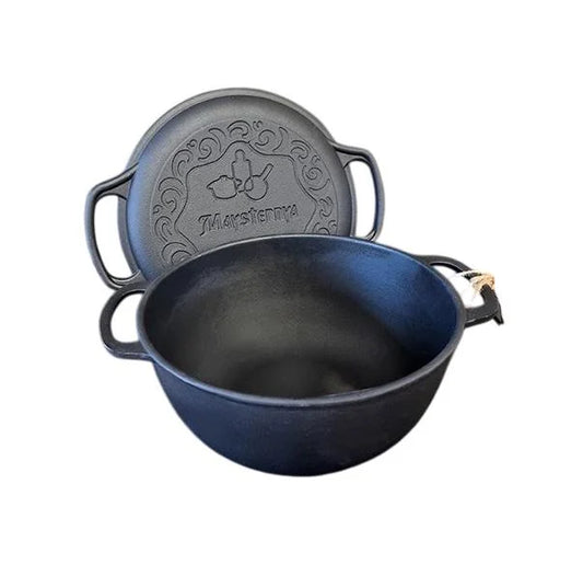 Black cast iron pot with lid on a white background