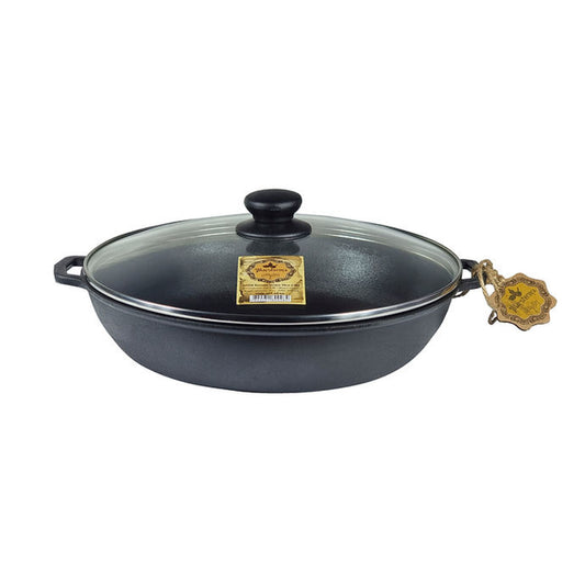 Black wok with lid on a white background