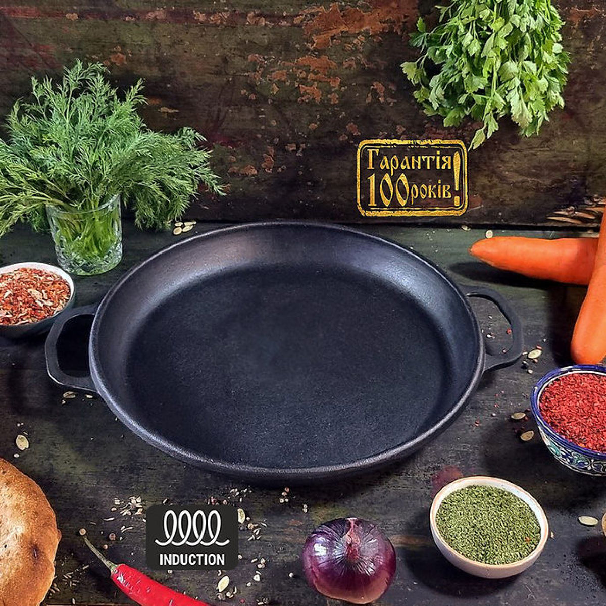 Black cast iron skillet on a rustic wooden surface with vegetables and herbs.