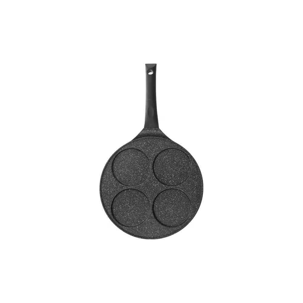 Black frying pan with four circular cooking areas on a white background