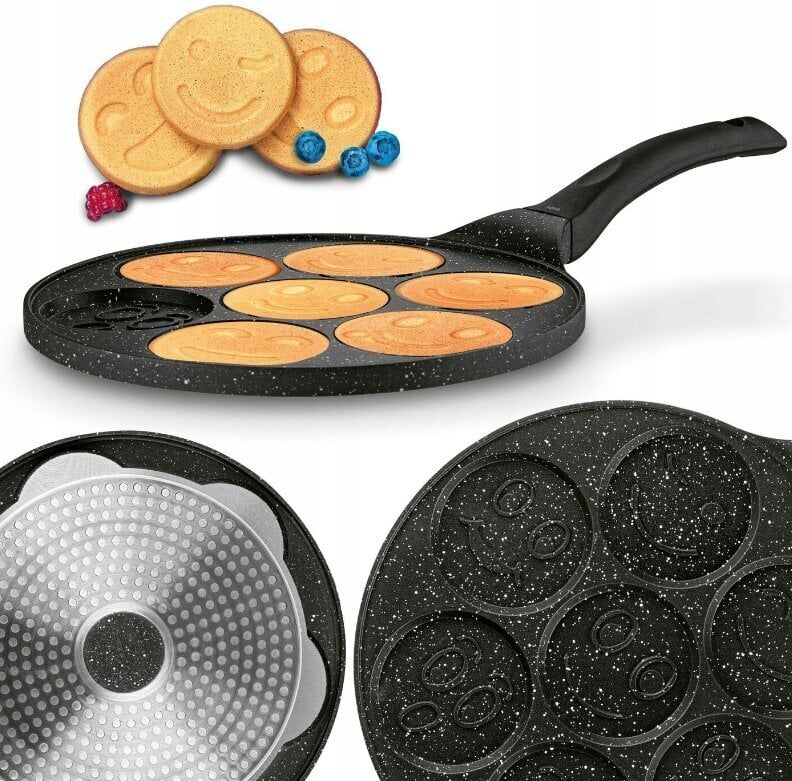 Non-stick pancake pan with smiley face designs on a white background